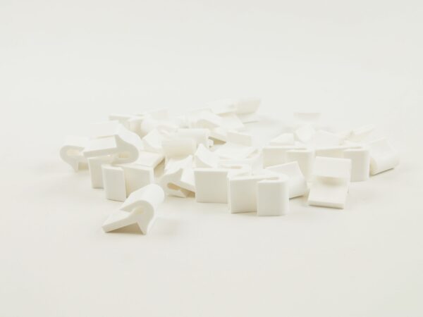 Zaczep do sprężyn falistych z ogranicznikiem